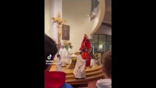 Italian Priest falls with a giant chocolate egg