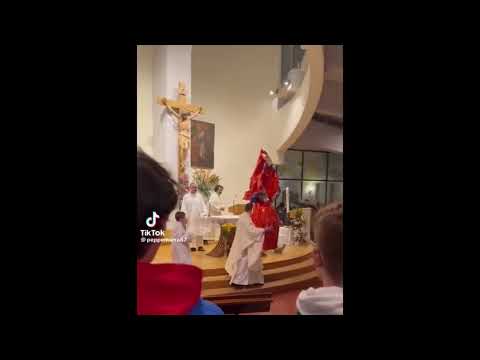 Italian Priest falls with a giant chocolate egg